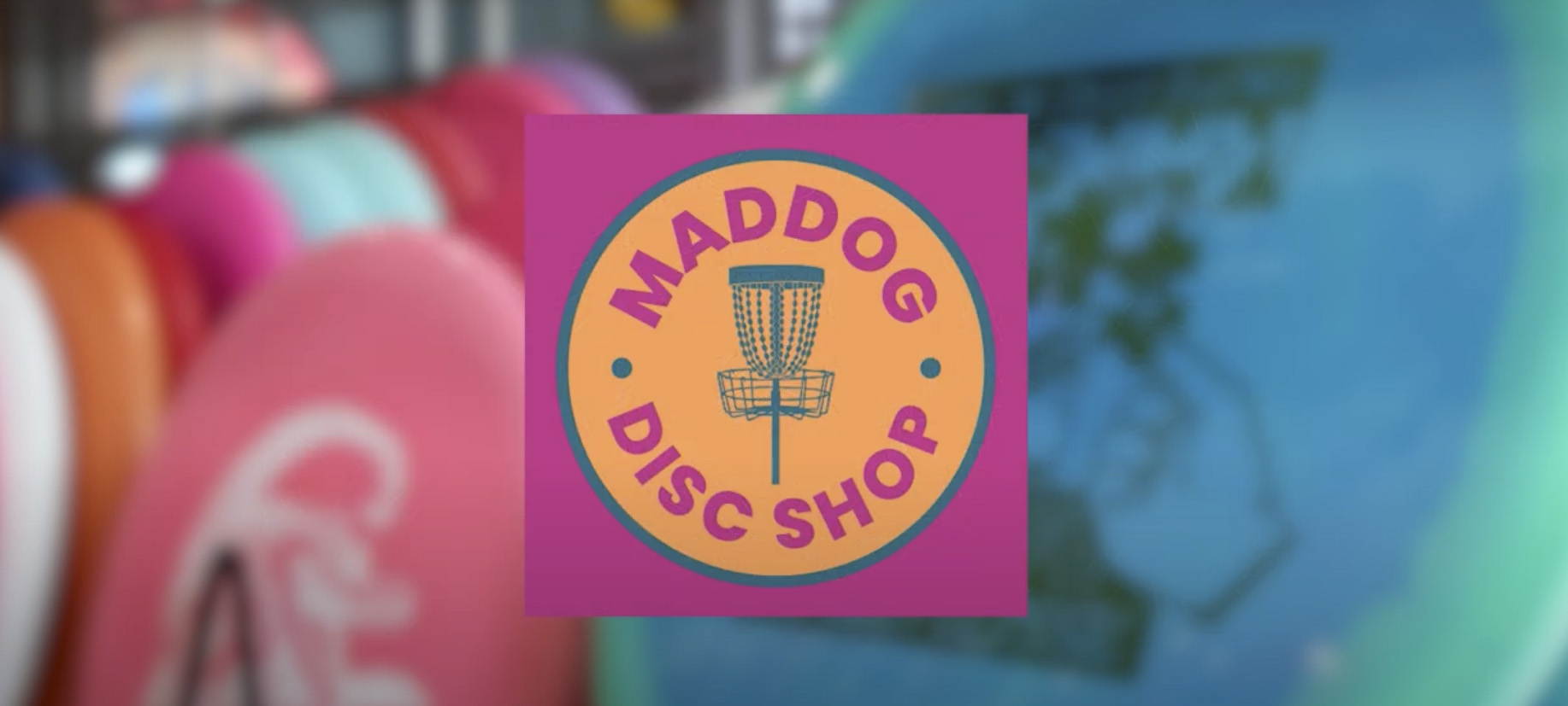Maddog Disc Shop logo over discs