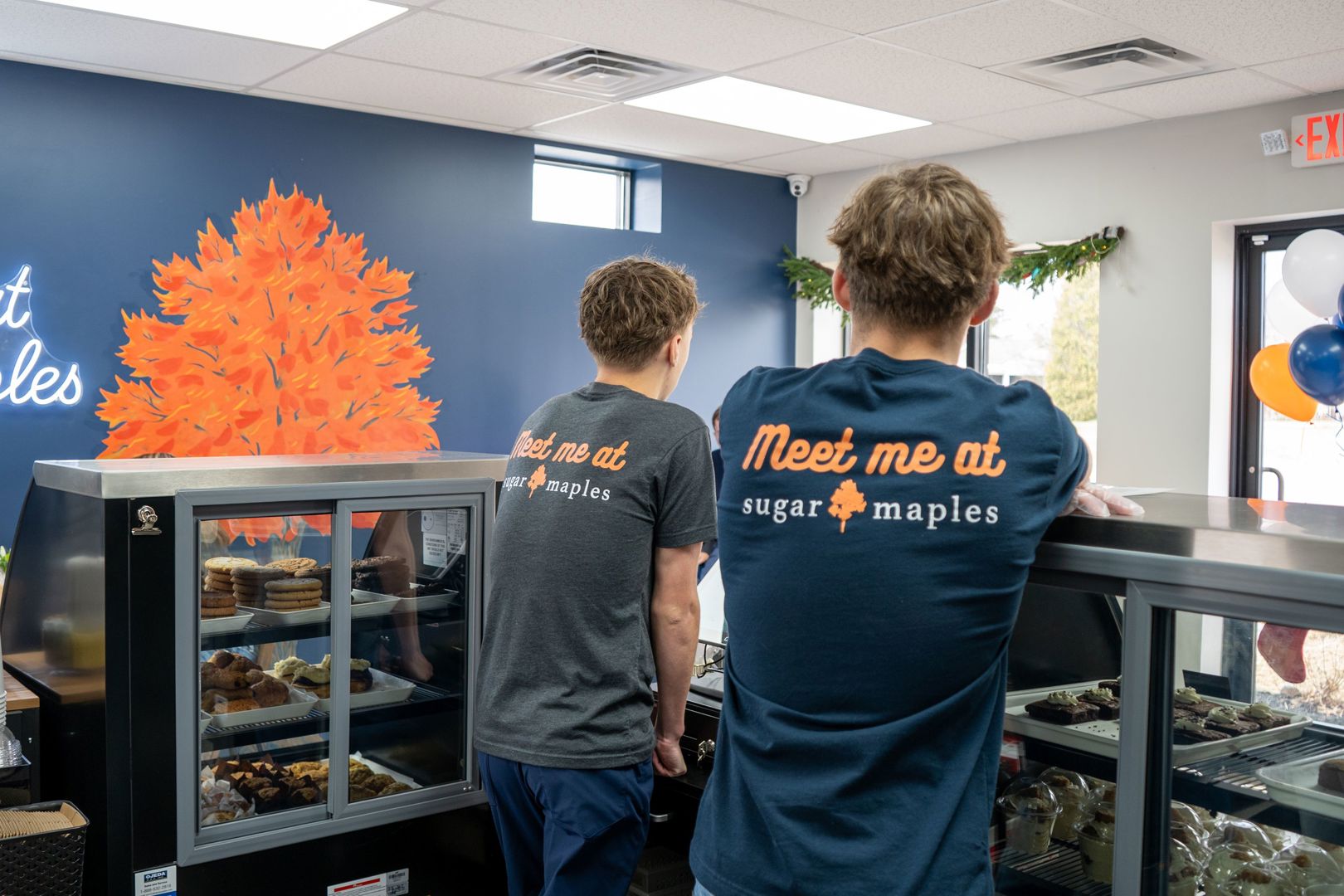 Sugar Maples bakery cases and employees